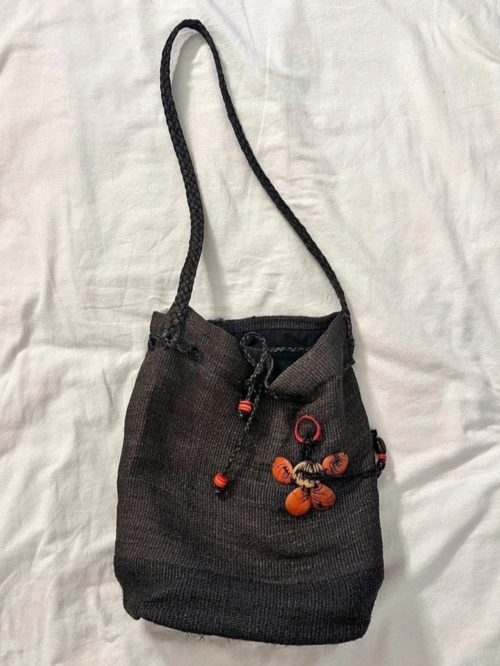 Woven Drawstring Bucket Bag with Butterfly Charm